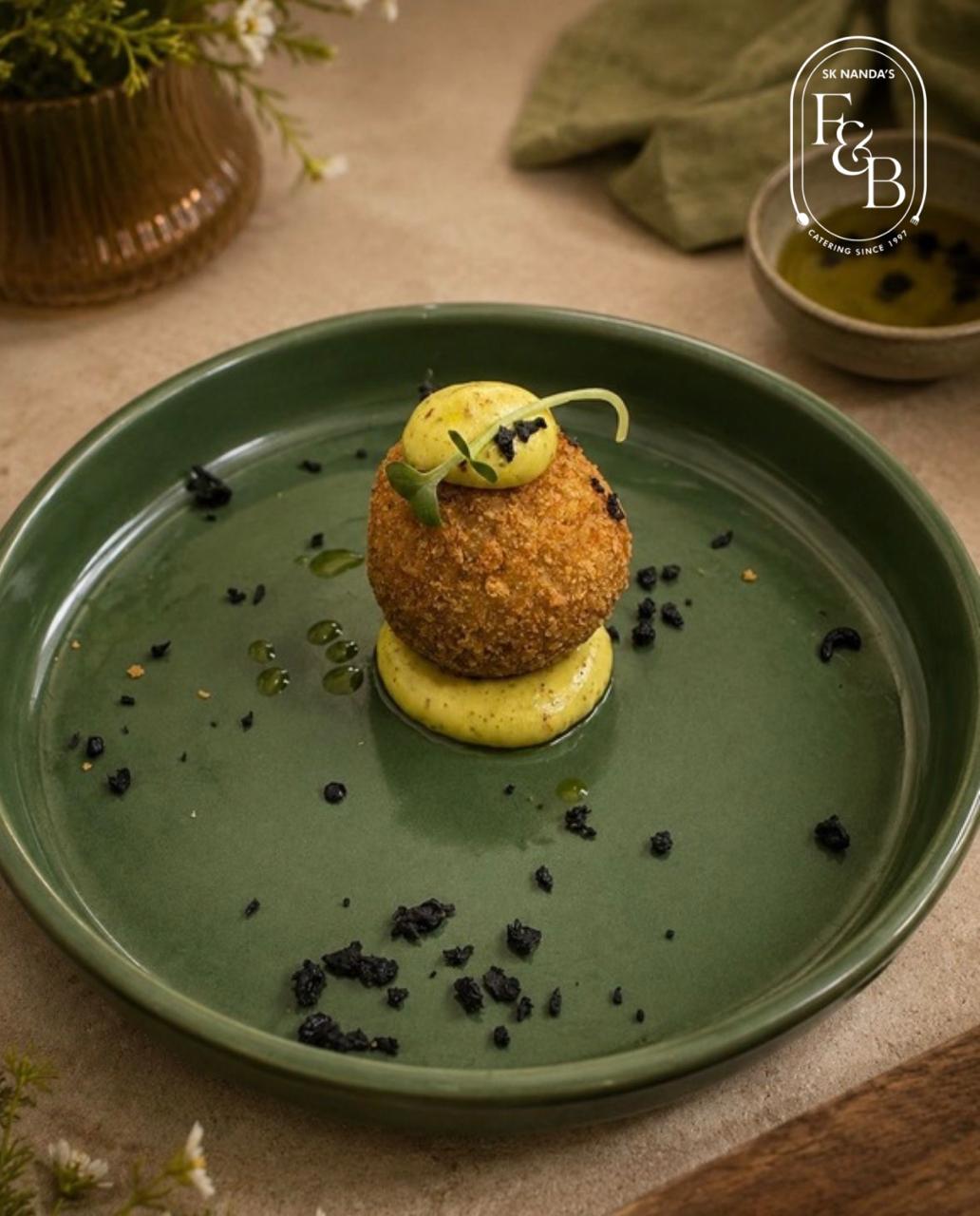 Truffle Arancini Sphere with Herb Emulsion at SK Nanda F&B